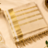 Kasavu Saree with Grand Golden Striped Pallu and Elegant Tassel Finish