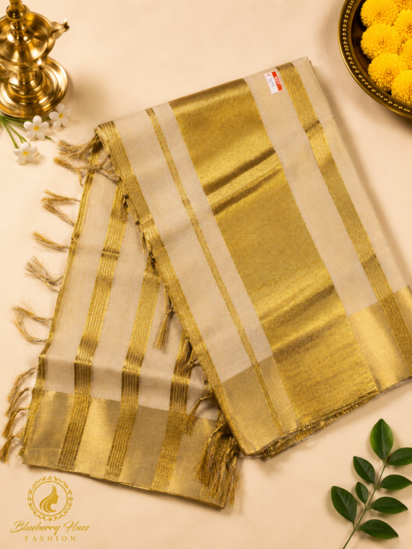 Kasavu Saree with Grand Golden Striped Pallu and Elegant Tassel Finish