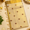 Kasavu Saree with Maroon Diamond Buttas and Grand Golden Zari Border