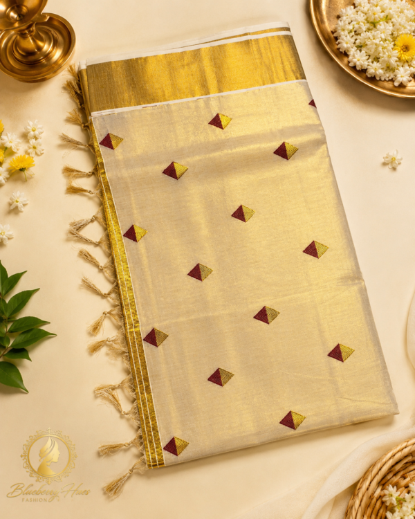 Kasavu Saree with Maroon Diamond Buttas and Grand Golden Zari Border