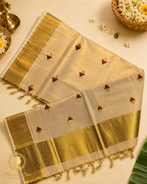 Kasavu Saree with Maroon Diamond Buttas and Grand Golden Zari Border