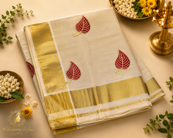 ATHAM – 29: Kerala Kasavu Saree with Maroon Leaf Embroidery and Grand Gold Border
