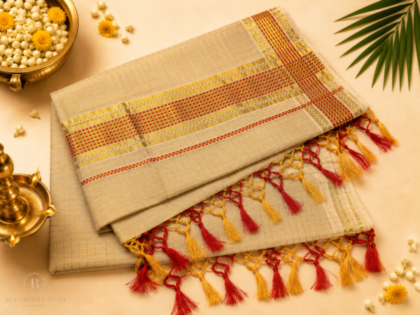 Kasavu-Saree-with-Red-Checked-Border-and-Tassel-Finish-1.png ATHAM – 21: Traditional Kerala Kasavu Saree with Red Checked Border and Tassel Finish | Onam Collection