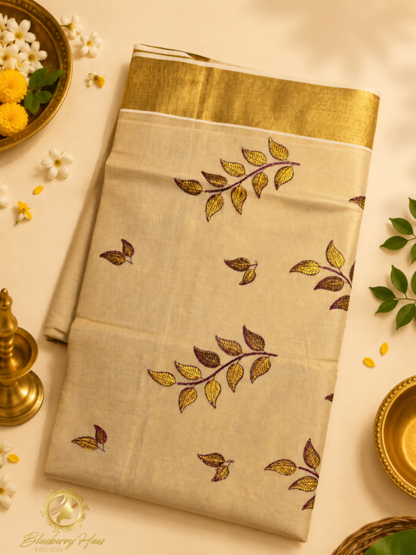ATHAM – 40: Kerala Kasavu Saree with Maroon Golden Leaf Embroidery and Grand Gold Border